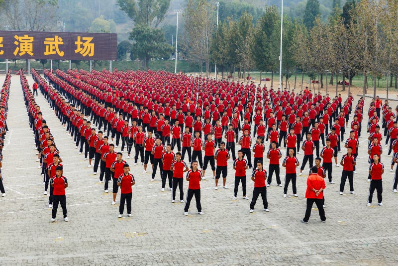 Denfeng, China - October 16, 2018: Children kung fu fighting school at the Shaolin Monastery Shaolin Temple , a Zen Buddhist temple. UNESCO World Heritage site. Denfeng, China - October 16, 2018: Children kung fu fighting school at the Shaolin Monastery Shaolin Temple , a Zen Buddhist temple. UNESCO World Heritage site